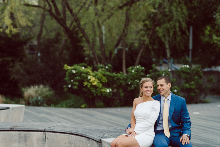 Colleen and Patrick had an intimate wedding ceremony at their church in Queens, NY then we went over to Gantry Plaza State Park LIC for their wedding photos. Colleen and Patrick's NYC elopement was nothing but fabulous and spectacle. When I saw all the food trucks lined up along Gantry Plaza State Park I knew I wanted to use it as our backdrop for Colleen and Patrick. Of course we chose "Mr Softee's Ice Truck" and as we were taking the photo one of Colleen and Patrick's cousin walked by doing the most epic photobomb ever! Colleen and Patrick's NYC elopement Gantry Plaza State Park LIC captured by NY NJ Weddings, Elopements and Family Photographer Karis by Hey Karis.